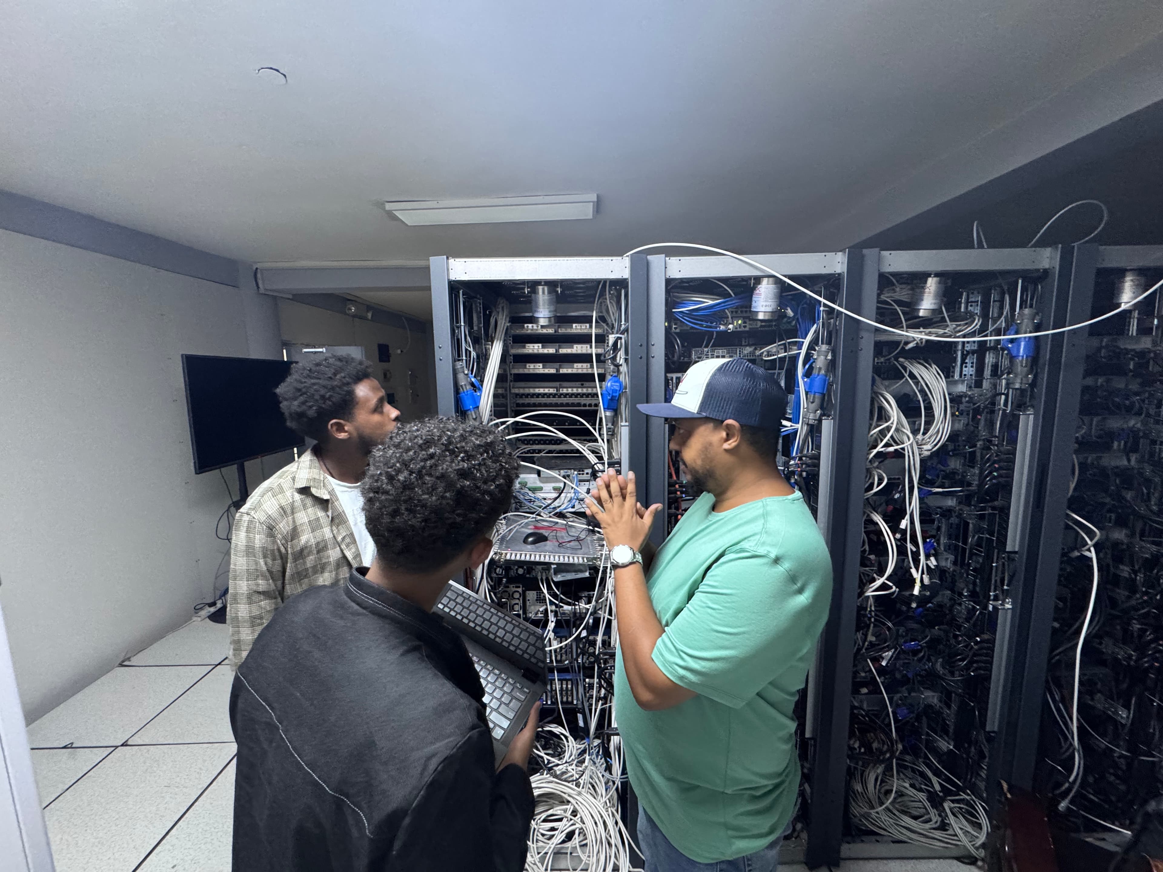 Demena engineers working together in a server room